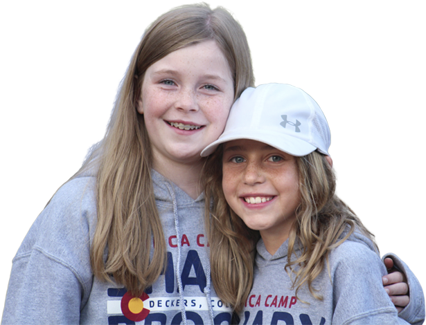 two smiling children in camp hoodies